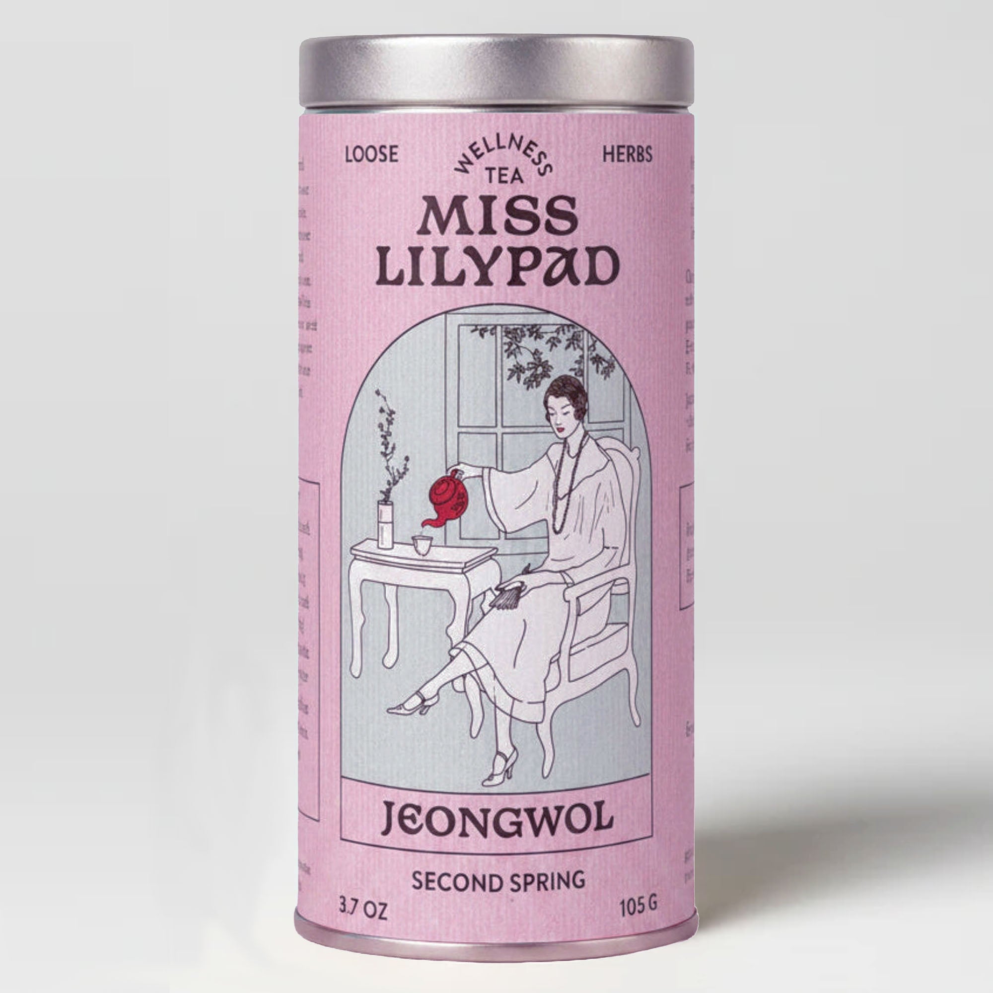 Miss Lilypad Second Spring loose herbal tea in a cylindrical tin canister with a pink label and silver metal lid and base. An illustration of a woman pouring tea from a red tea pot
