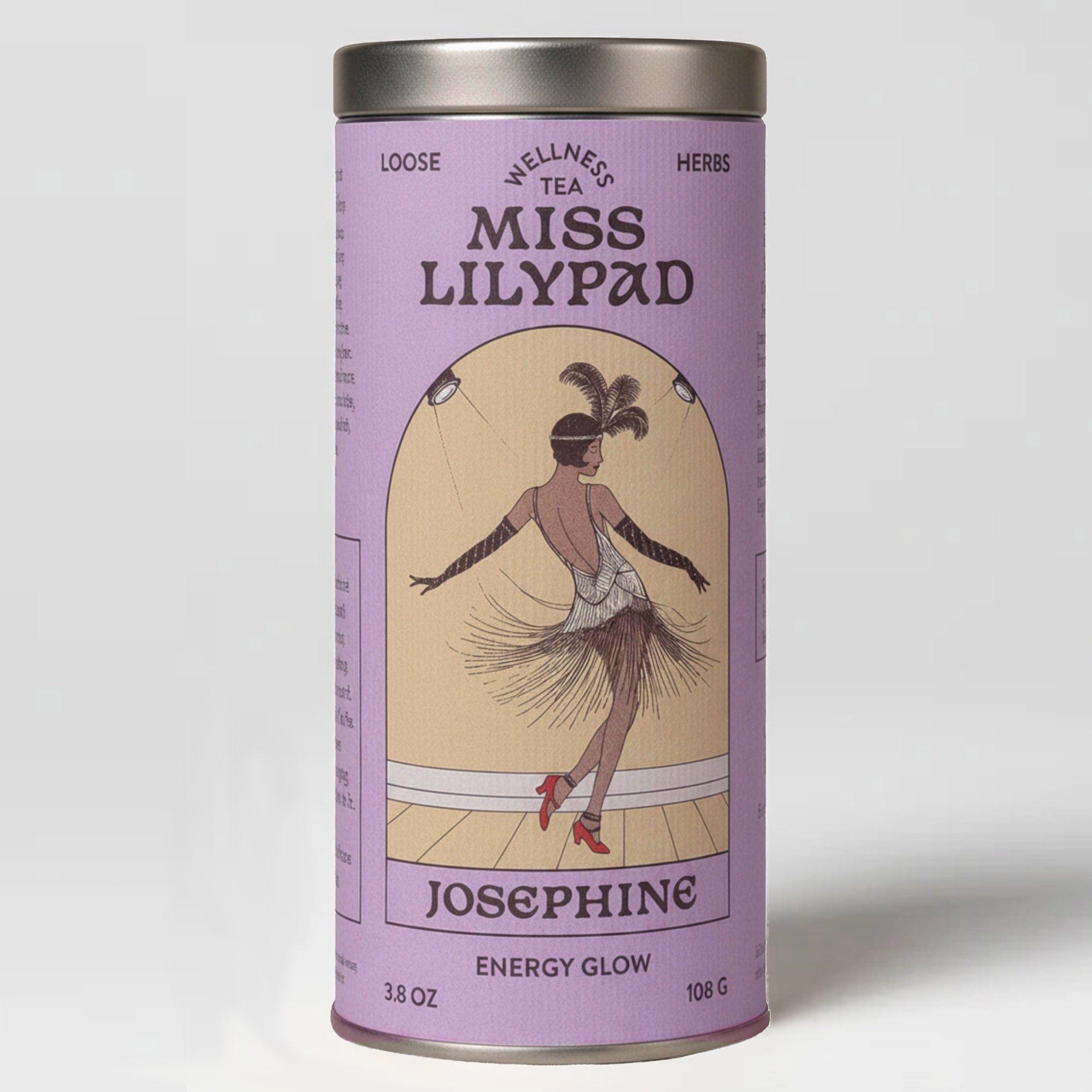 Miss Lilypad Energy Glow Josephine loose herbal tea in a cylindrical tin canister with a lavender label and silver metal lid and base. An illustration of a woman in a flapper outfit and red shoes dancing under stage lights